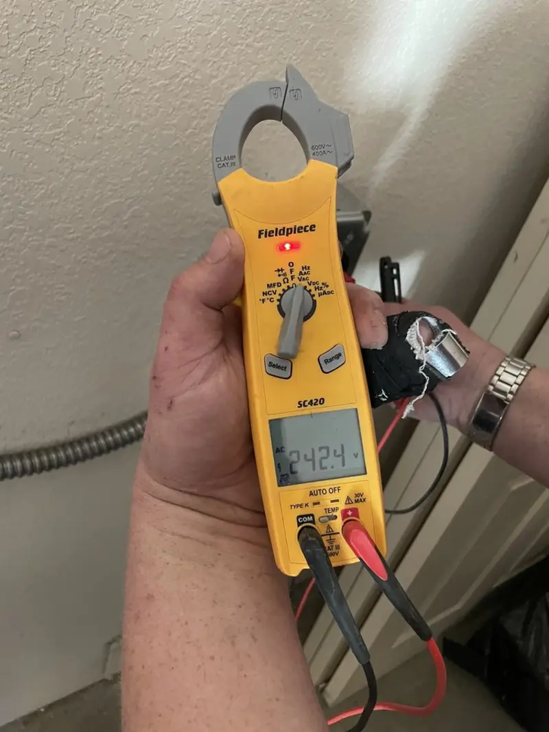 Voltage testing with clamp meter during Electrical Installation Services in Sauk Village